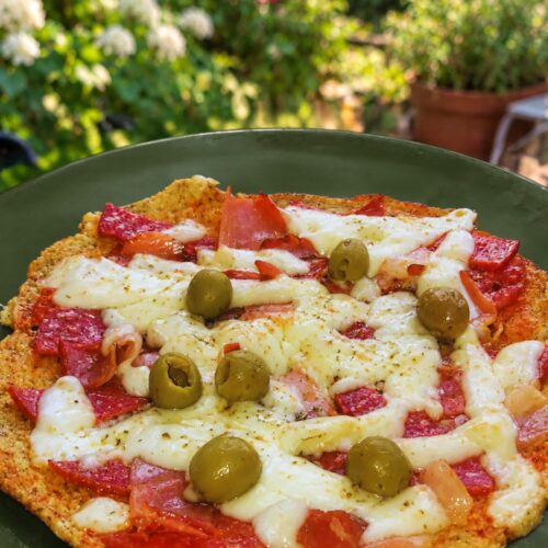Low Carb Skillet Pizza 7 Low carb skillet pizza topped with melted cheese, salami, bacon, and olives