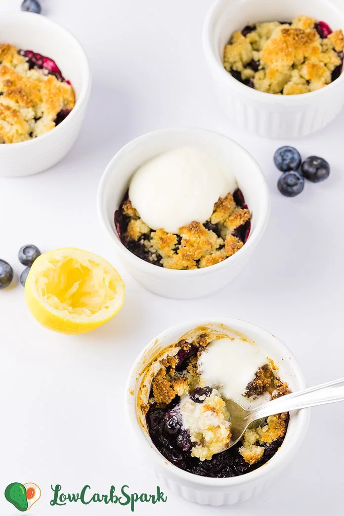 The Best Buttery Keto Blueberry Cobbler 5 Spoonful of keto blueberry cobbler showing juicy blueberries and buttery crumb topping