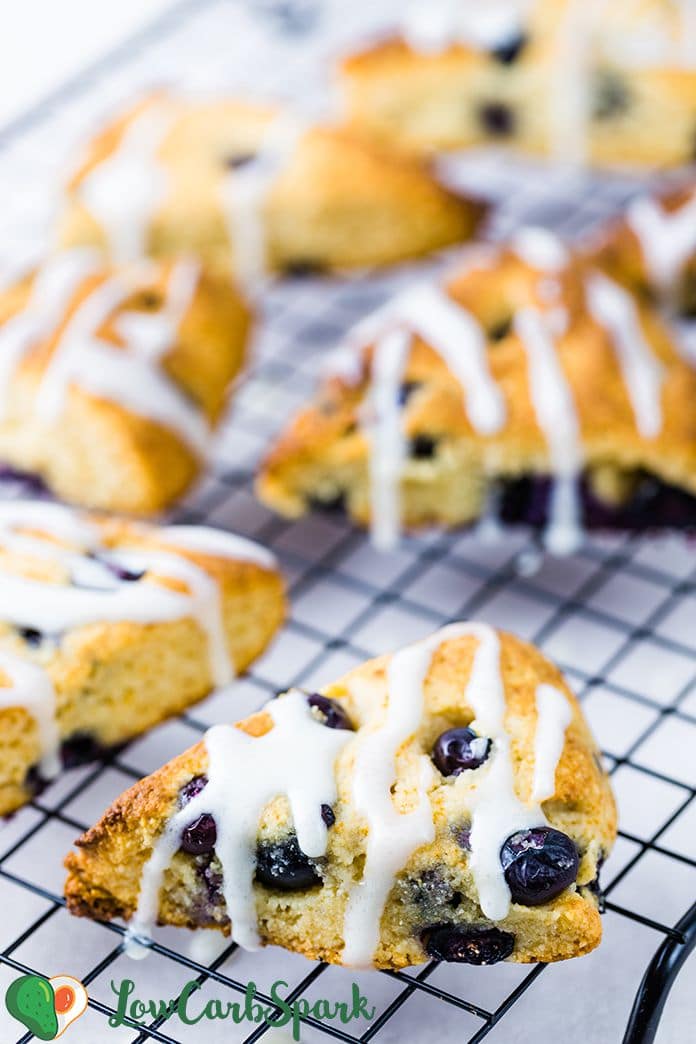 These Keto Blueberry Scones are perfect for a quick breakfast or snack. Enjoy these moist scones with juicy blueberries that are topped with an exquisite sugar-free lemon glaze. Their texture is fantastic: crispy edges, soft, tender, and buttery - melt-in-your-mouth scones.