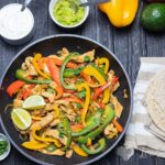 These Easy Chicken Fajitas are healthy, quick to make and perfect for a weeknight dinner. The chicken is succulent, super flavourful and the low carb tortillas are fantastic. Enjoy this one-pan meal made with peppers, onions, chicken spicy fajita seasoning.