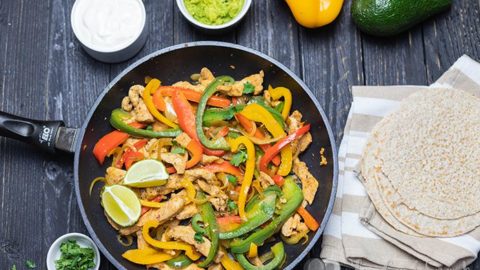These Easy Chicken Fajitas are healthy, quick to make and perfect for a weeknight dinner. The chicken is succulent, super flavourful and the low carb tortillas are fantastic. Enjoy this one-pan meal made with peppers, onions, chicken spicy fajita seasoning.