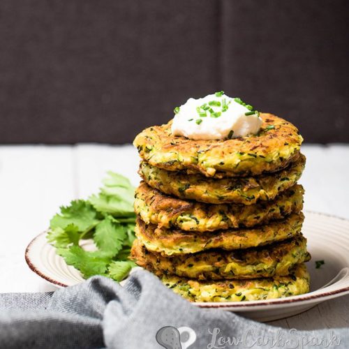These zucchini fritters are extremely easy to make, low in carbs and family friendly. Keto zucchini pancakes that are delicious served warm with sour cream, fantastic for meal prep and perfect snack for summer.