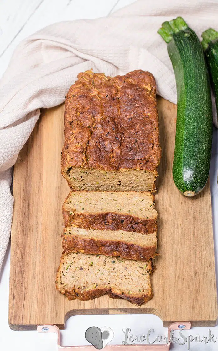  The easiest keto zucchini bread recipe! It's super moist, perfectly spiced and low in carbs bread with grated zucchini, cinnamon, nutmeg, and optional walnuts or pecans. #ketobread #zucchinibread