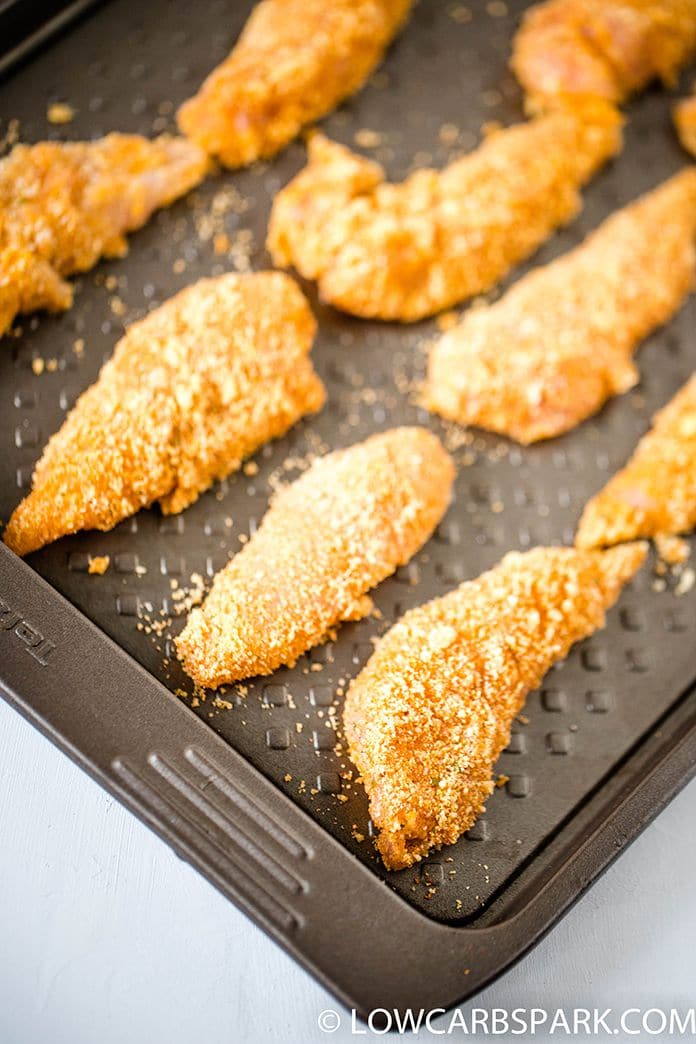 chicken tenders ready to bake in a pan
