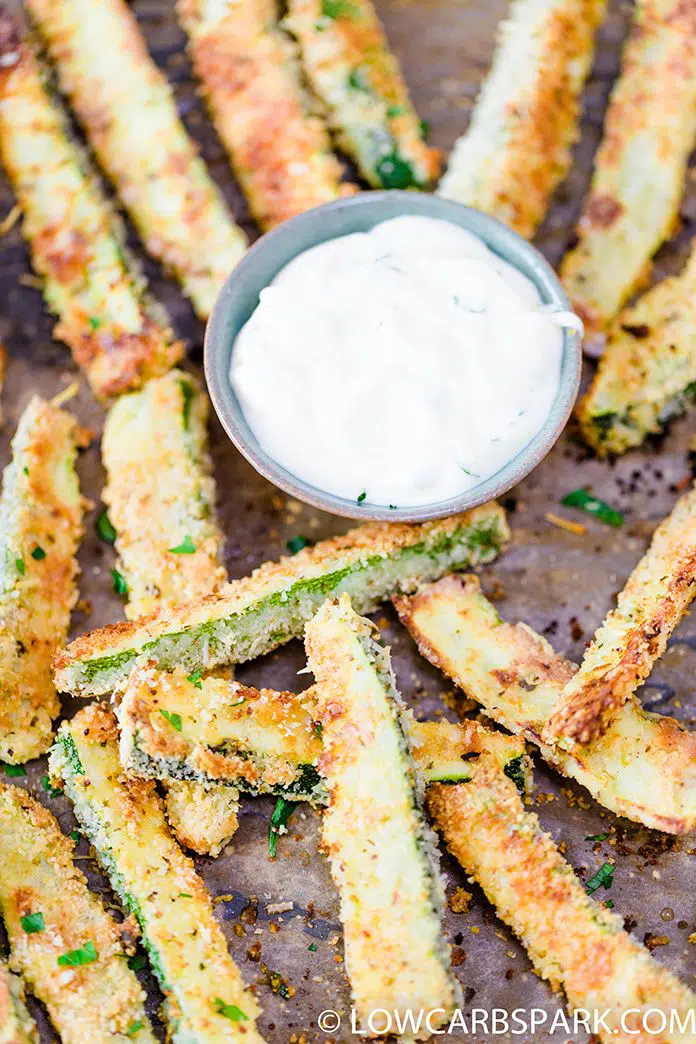 These crispy baked zucchini fries are delicious, satisfying, cheesy, and easy to make. Enjoy these fries as a keto healthy snack, appetizer or side dish for just 4g carbs a serving.