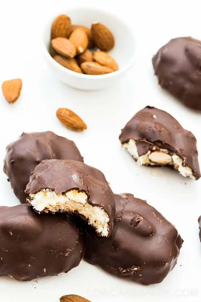 The homemade almond joy recipe has the same texture as the original bar with a dense coconut filling and a crunchy almond in the middle. Dark chocolate, coconut, and almonds are the perfect pair in this delicious homemade dessert.