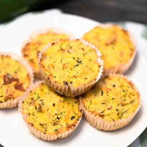 Zucchini Cheddar Cheese Savory Keto Muffins 6 Learn how to make gluten-free Zucchini Savory Muffins for the best on-the-go keto breakfast option. They're moist, keto-friendly, and perfect for meal prepping. These low carb zucchini muffins are buttery with a garlicky taste, moist inside, and the best crispy golden top.