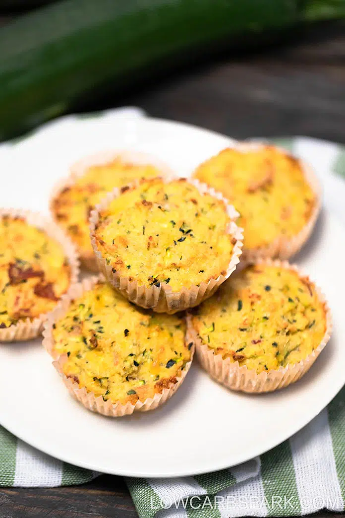 Learn how to make gluten-free Zucchini Savory Muffins for the best on-the-go keto breakfast option. They're moist, keto-friendly, and perfect for meal prepping. These low carb zucchini muffins are buttery with a garlicky taste, moist inside, and the best crispy golden top.