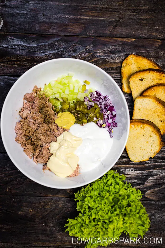 Just a few essentials ingredients are needed for this classic tuna salad recipe. It is creamy and flavorful served on its own, sandwiches, on a bed of greens, wrapped in lettuce for an easy work lunch or weeknight meal.  