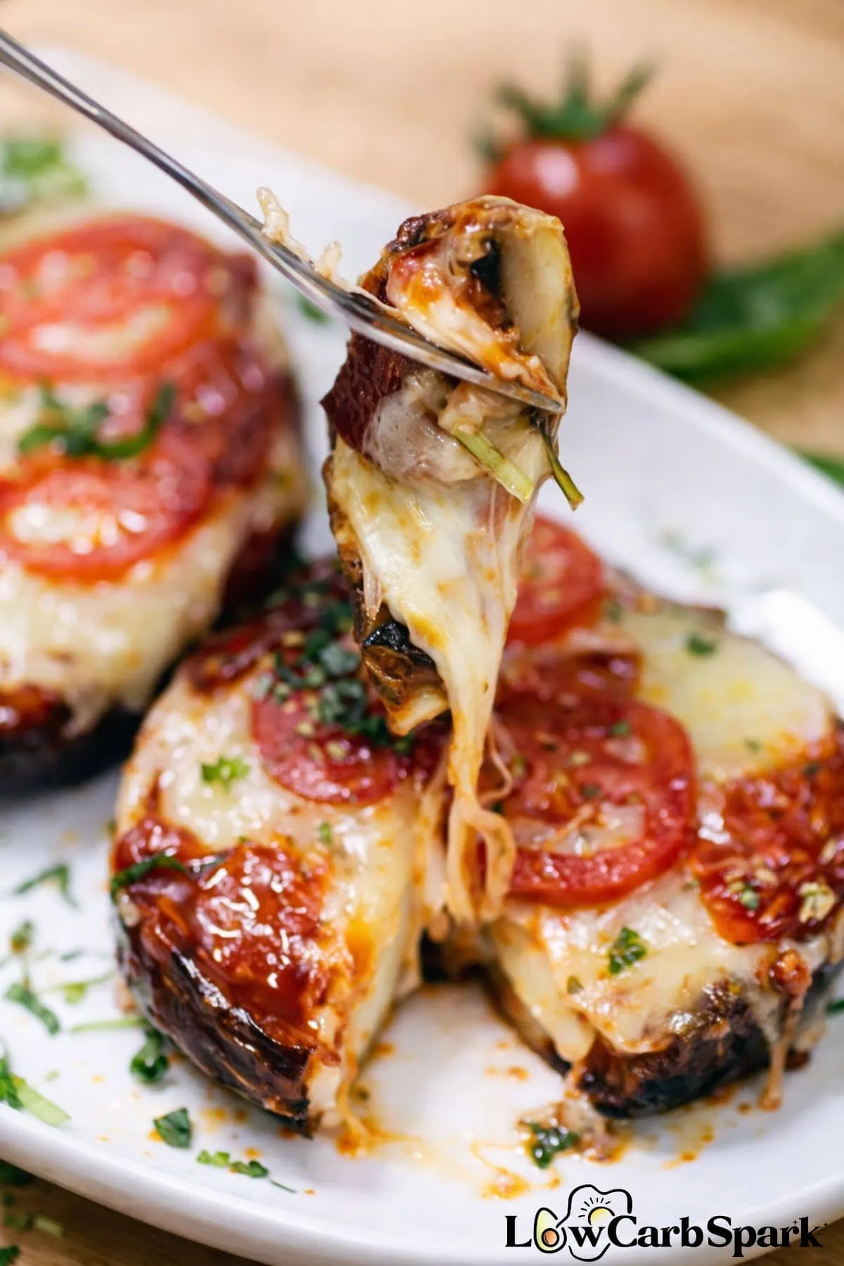 10-Minute Portobello Mushroom Pizza 2 Portobello mushroom pizza lifted with a fork showing melted mozzarella