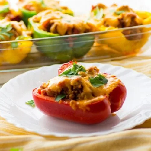 Healthy Keto Stuffed Peppers 8 Cooked keto stuffed pepper served on a plate with melted cheese