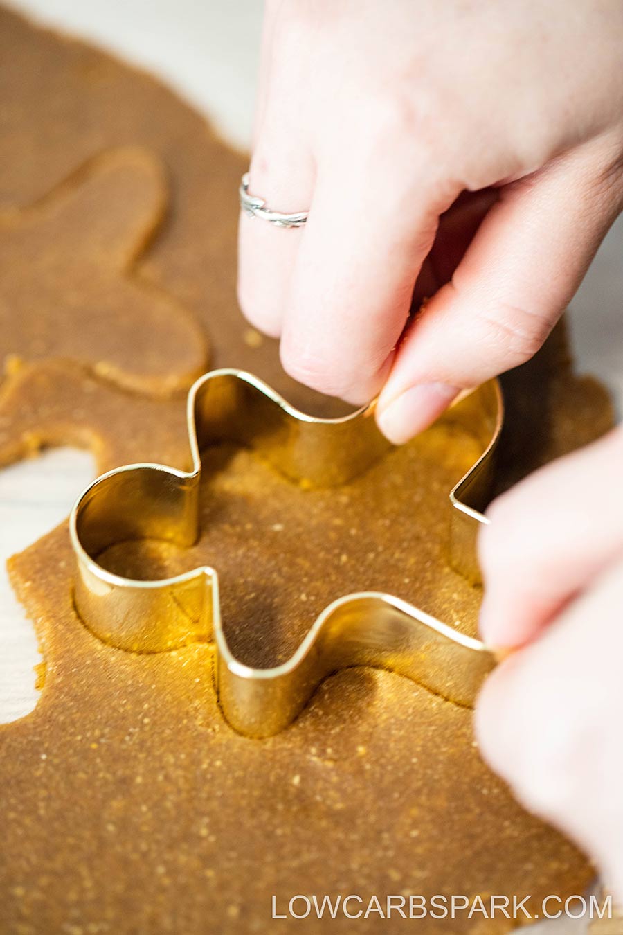 cut the gingerbread cookies with cookies cutters
