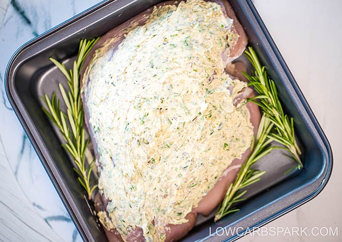 TURKEY BREAST WITH GARLIC HERB BUTTER in a baking pan