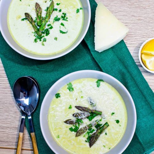 asparagus soup in a bowl served with parmesan