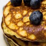 keto pancakes stack with blueberries on top
