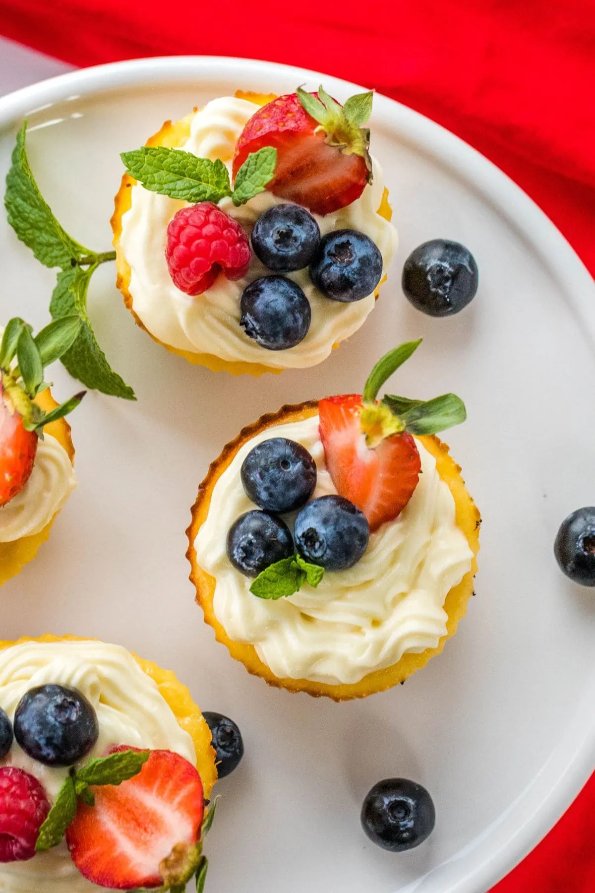 Keto Mini Cheesecakes 2 the best keto low carb mini cheesecake on a white plate