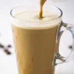 pouring bulletproof coffee into a transparent mug