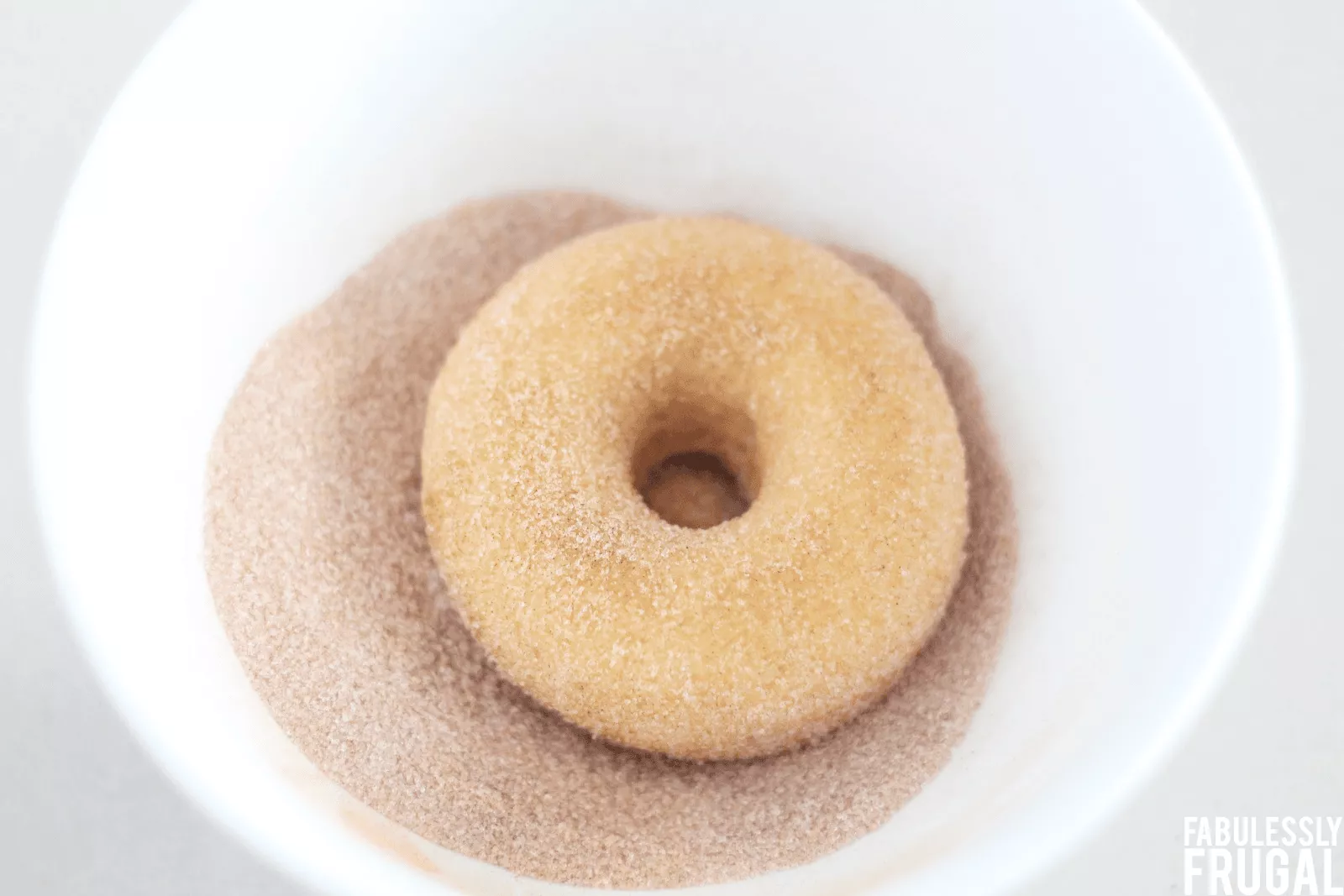 coat keto donuts in cinnamon and erythritol.png