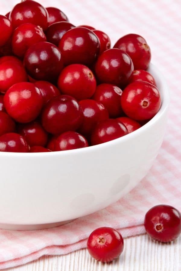 a bowl with red cranberries