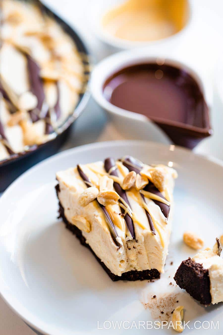 Learn how to make this homemade Keto Peanut Butter Pie from scratch with just a few low carb ingredients. It's a crazy creamy no-bake keto pie that everyone loves. This dreamy low carb pie has a chocolatey Oreo like crust and a luscious sugar-free peanut butter filling.