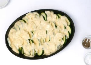 Best Zucchini Casserole - Super Creamy and Cheesy 13 mixture over the zucchini slices