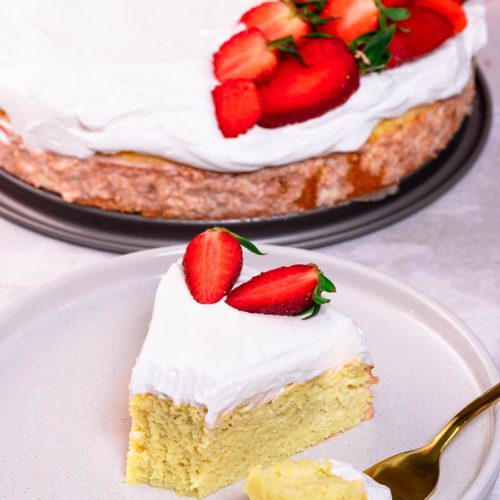 Keto tres leches cake slice on a plate