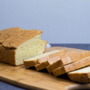 The Best Keto Bread Recipe 12 slices of keto bread on a wooden boars