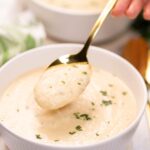 Keto Cauliflower Soup in a bowl with a spoon