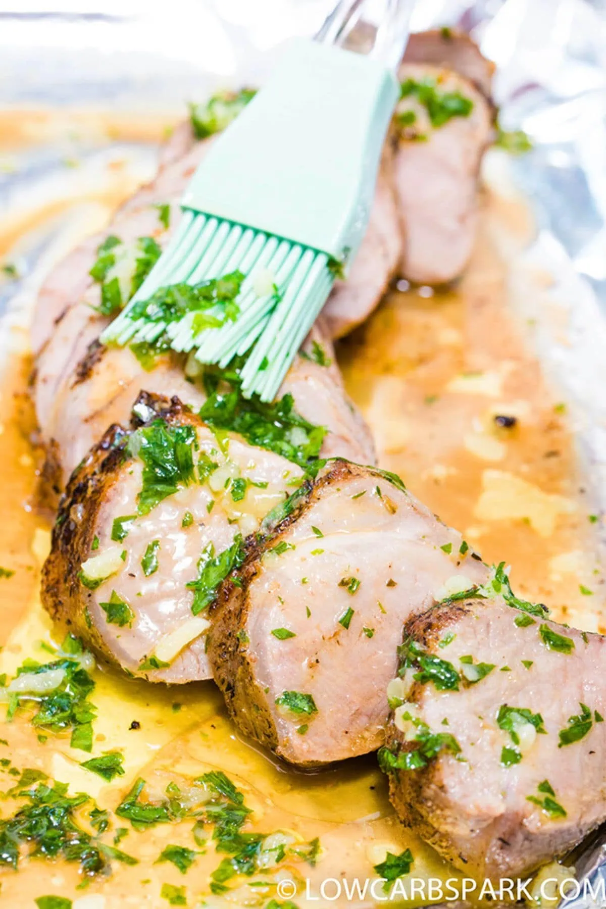 Garlic Butter Pork Tenderloin 6 brushing garlic butter pork tenderloin with garlic butter