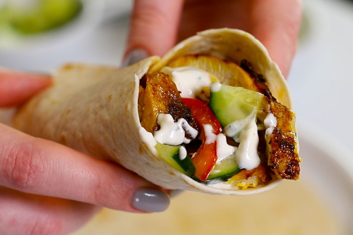 Easy Chicken Shawarma 11 Homemade chicken shawarma wrap with juicy spiced chicken, fresh vegetables, and creamy yogurt sauce.