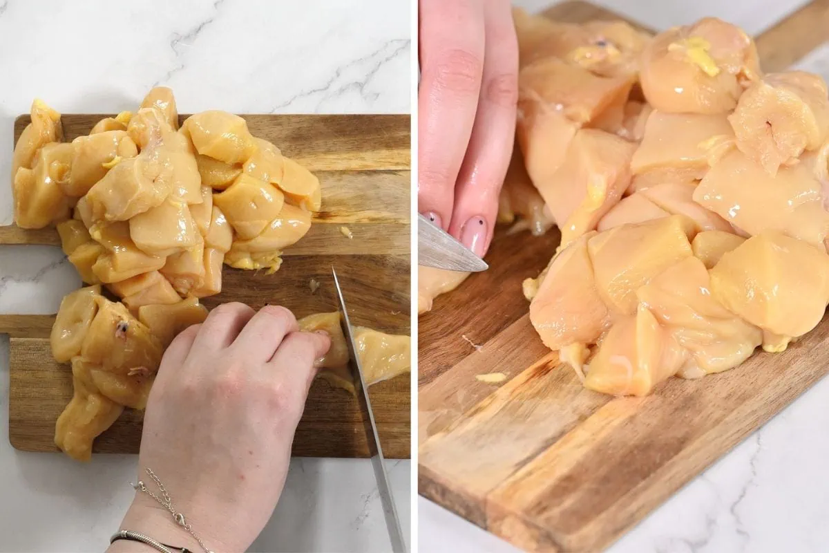 Air Fryer Lemon Chicken Bites 4 Slicing raw chicken breasts into bite-size cubes on a wooden board.