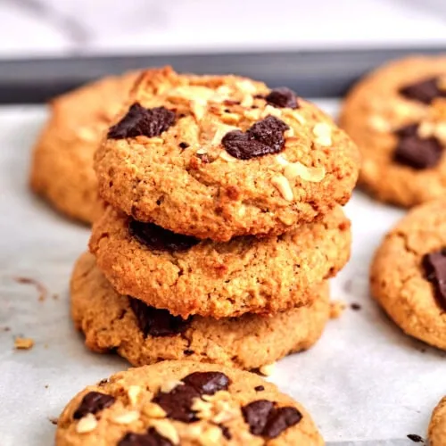 Keto Marry Me Cookies 6 Almond flour cookies with melted dark chocolate and crushed nuts arranged in a neat stack.