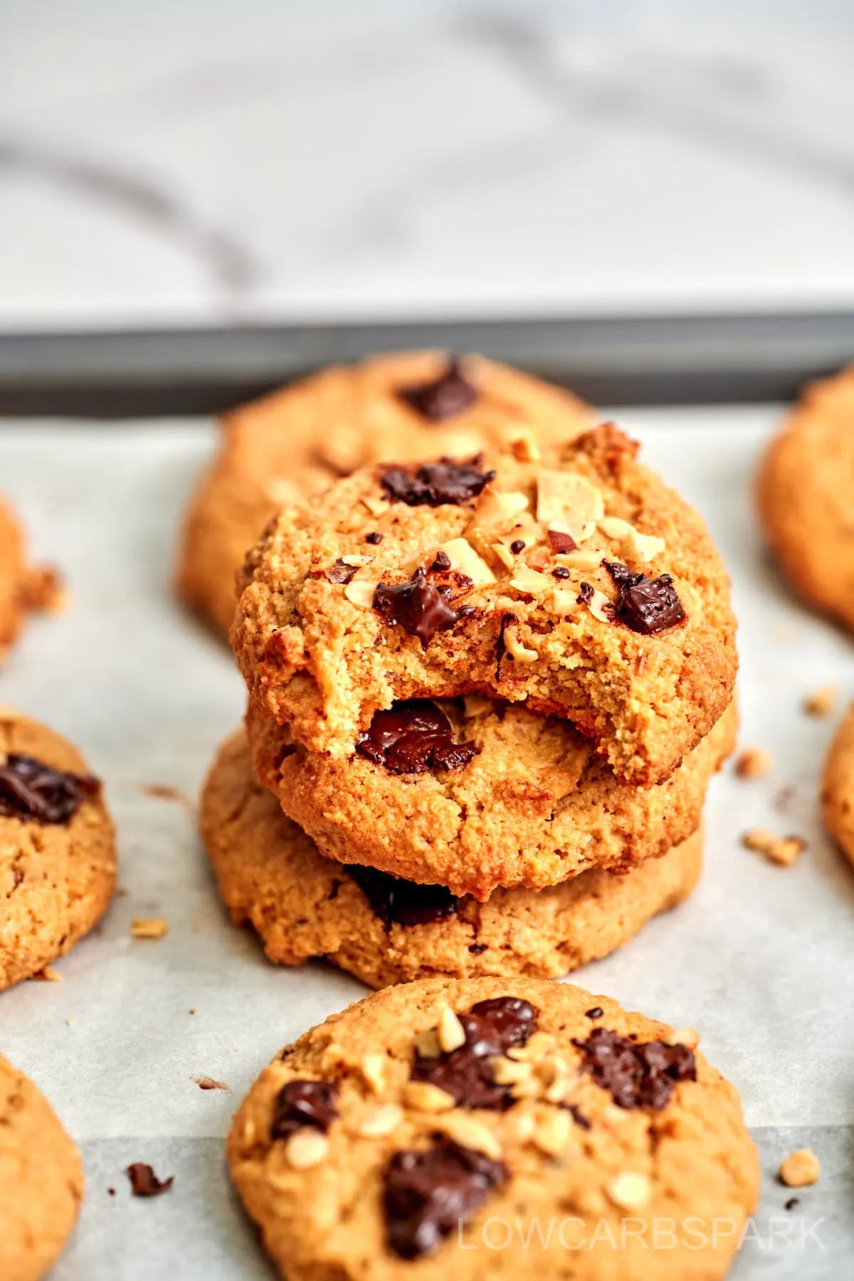 Keto Marry Me Cookies 5 Fresh stack of homemade cookies with one showing a perfect bite.