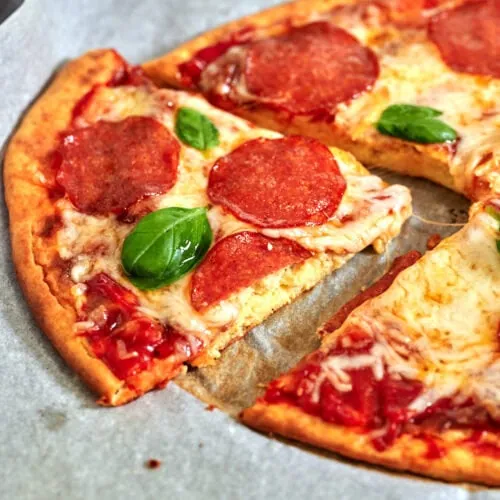 Cottage Cheese Pizza Crust 5 Keto pizza slice showing golden, fluffy cottage cheese crust and melty cheese topping.