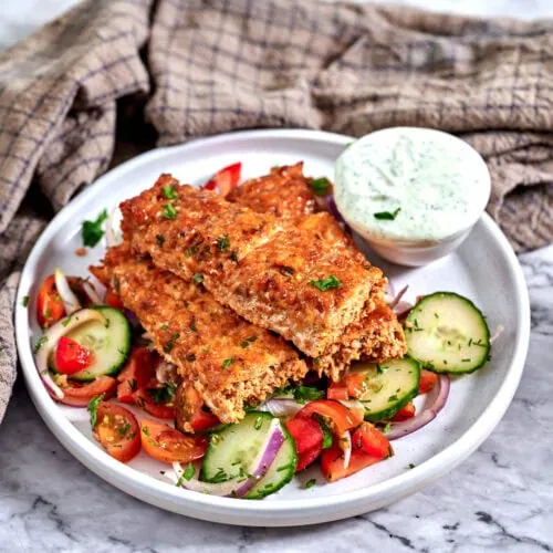 Sheet Pan Ground Chicken Kebabs 12 Ground chicken kebabs served on a fresh tomato cucumber salad with creamy yogurt dip.