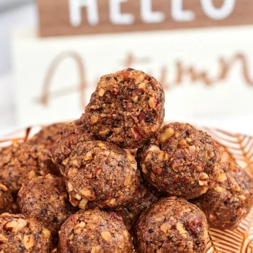 High-Protein Pecan Pie Balls 9 a plate with several pecan pie balls stacked
