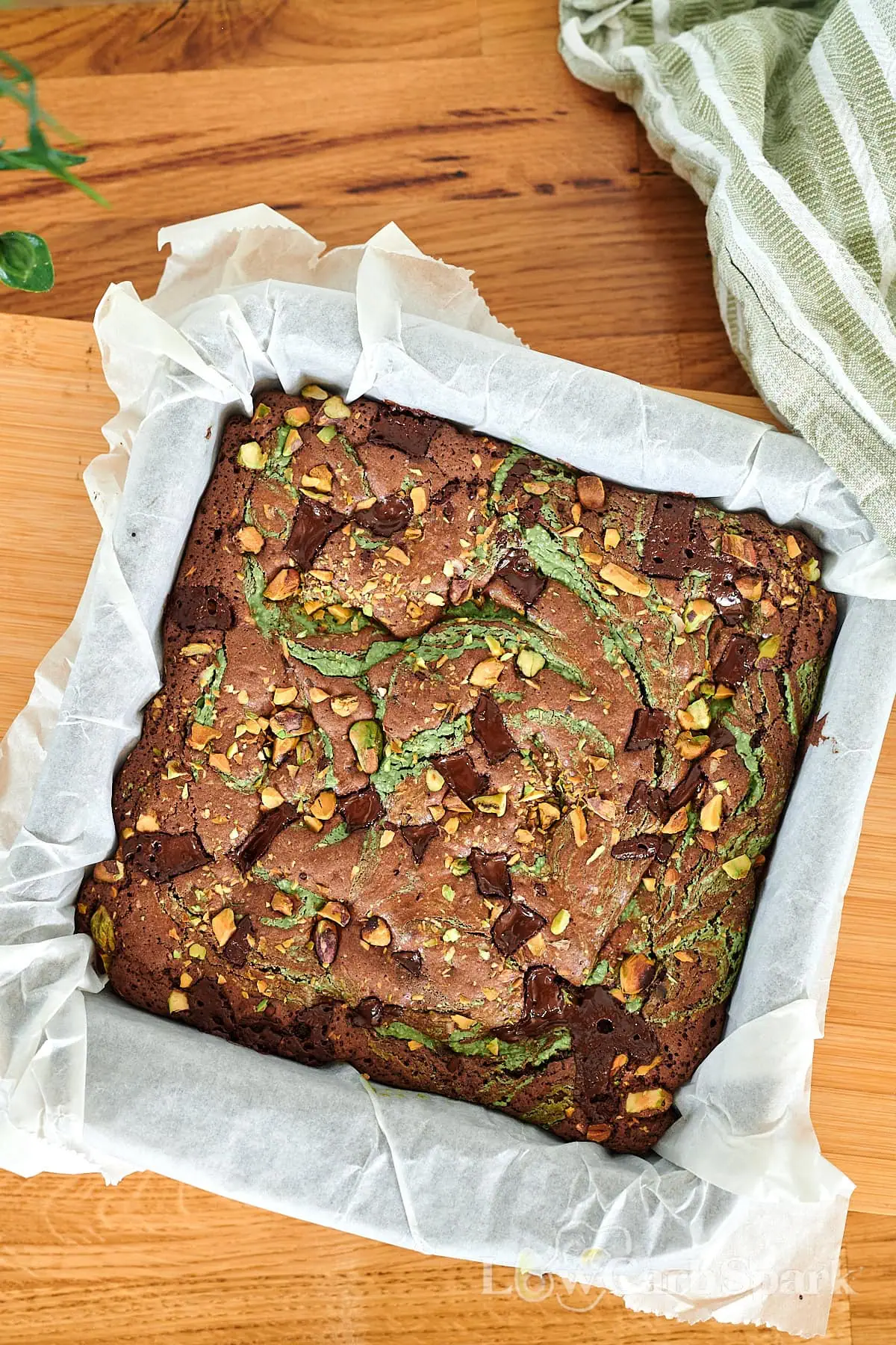 Fudgy Gluten-Free Pistachio Brownies 4 Pan of freshly baked pistachio swirl brownies with melty chocolate and chopped nuts.