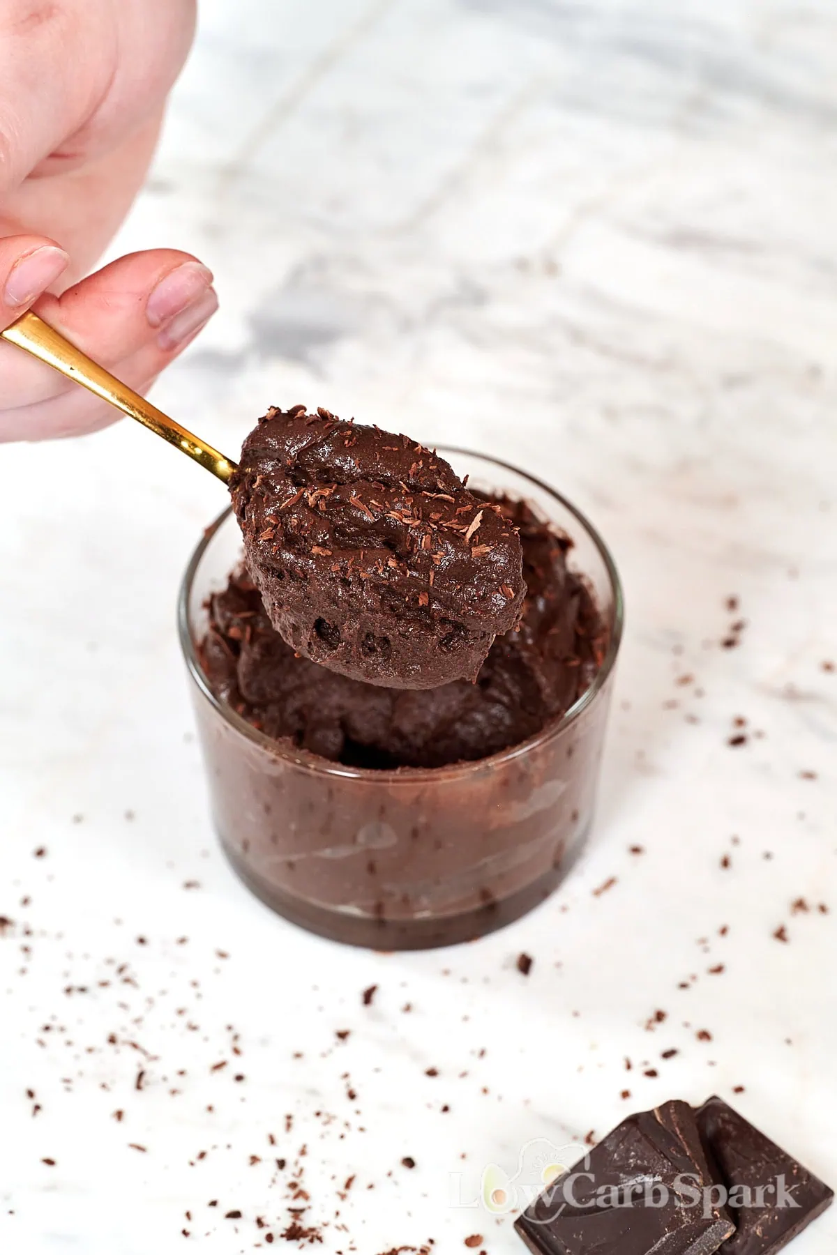 Boiled Egg Chocolate Mousse 7 Close-up of creamy low-carb chocolate mousse being scooped from a glass cup.