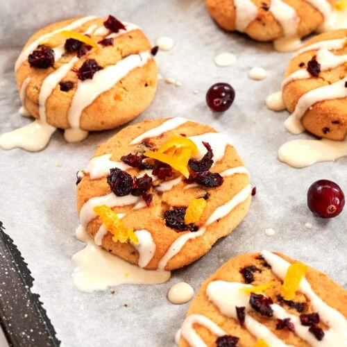 Almond Flour Cranberry Orange Cookies 12 Freshly baked cranberry orange cookies drizzled with icing and topped with dried cranberries and orange zest.