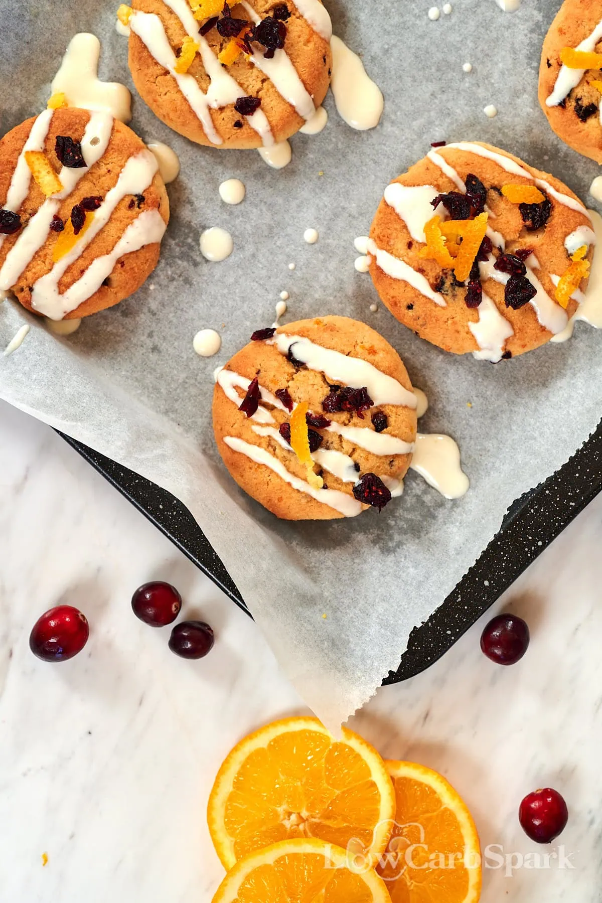 Almond Flour Cranberry Orange Cookies 10 Batch of keto cranberry orange cookies fresh out of the oven with citrus zest and glaze.