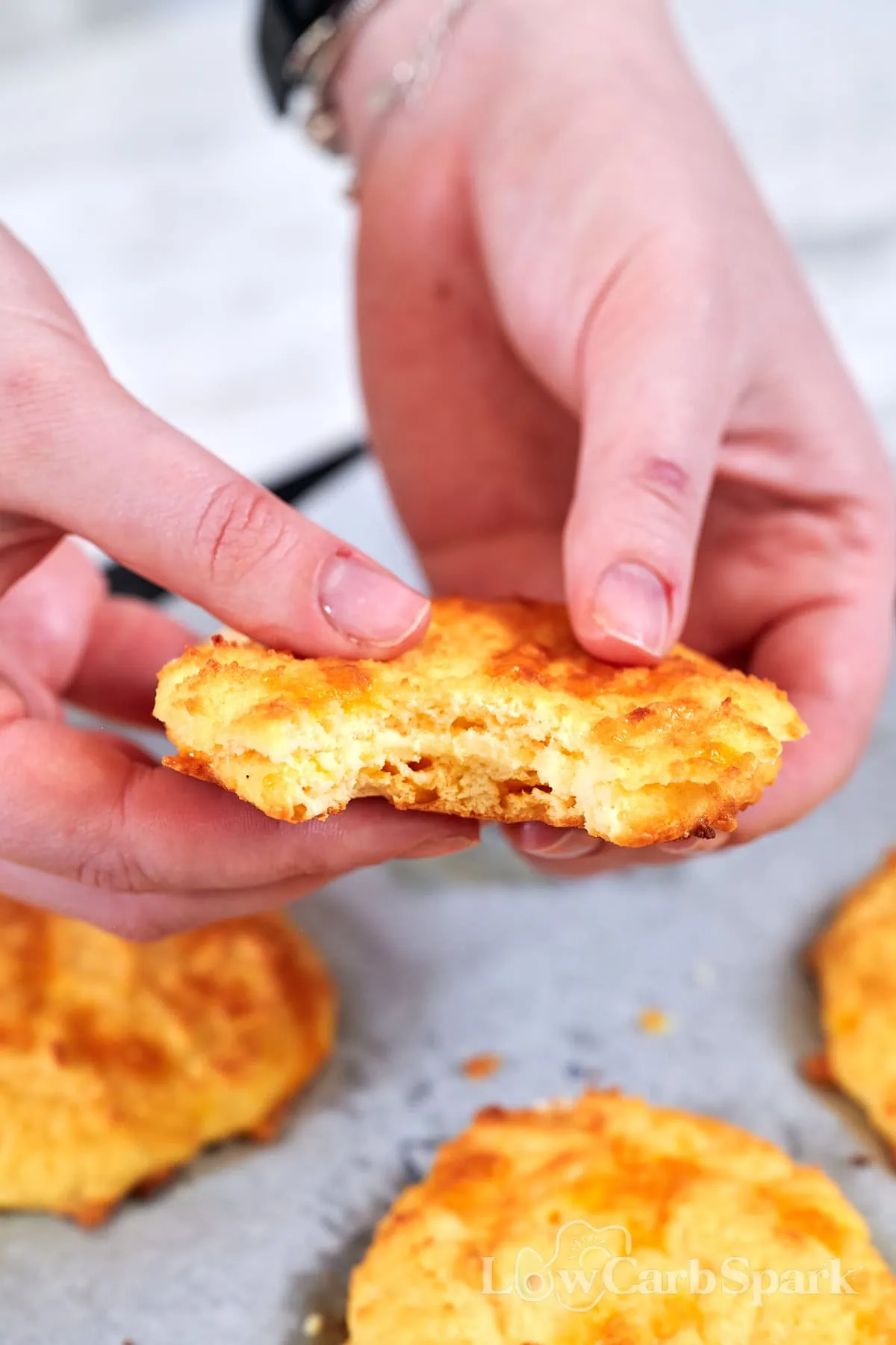 Low Carb Cottage Cheese Biscuits 8 Soft and golden cottage cheese biscuit split in half to show the moist, tender crumb.