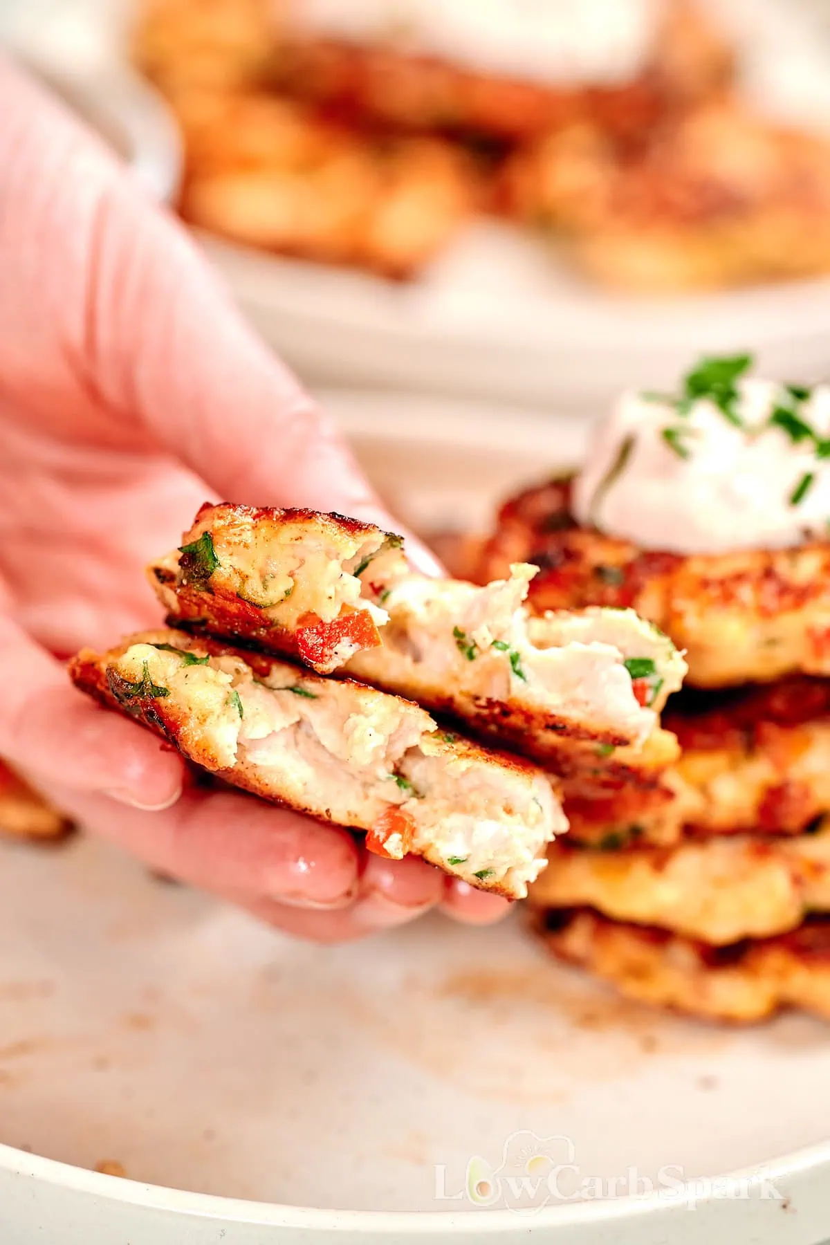 Cheesy Chicken Fritters 9 Inside view of a cheesy chicken fritter with peppers and herbs