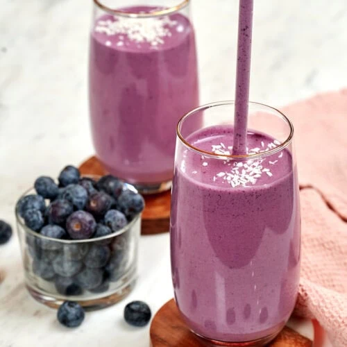 Cottage Cheese Blueberry Smoothie (High Protein!) 9 Cottage cheese blueberry smoothie in glasses topped with shredded coconut