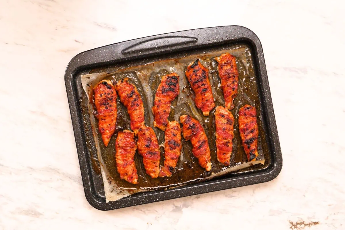 Barbecue Bacon-Wrapped Chicken Tenders 7 Fully cooked barbecue bacon-wrapped chicken tenders fresh from the oven