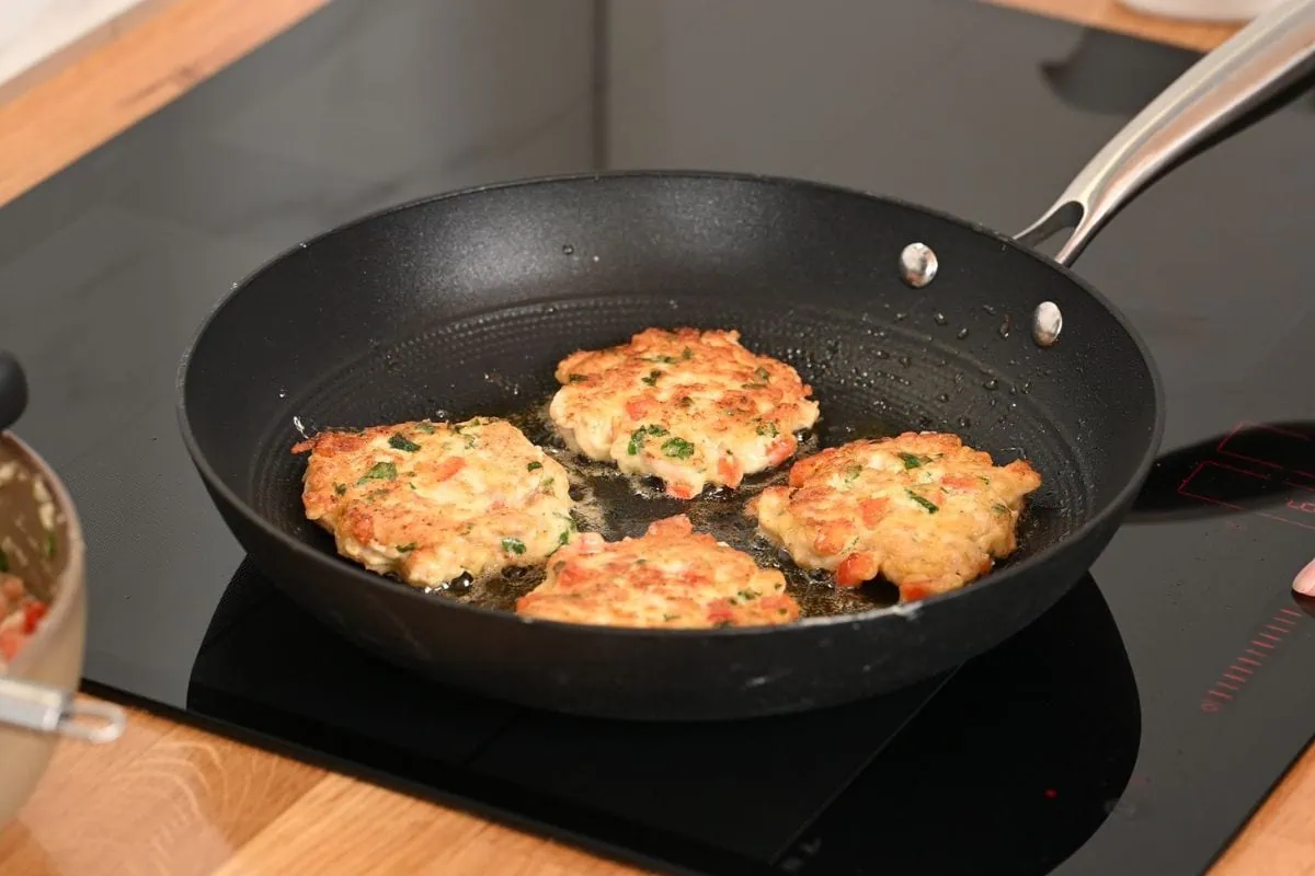Cheesy Chicken Fritters 7 Pan-frying chicken fritters until golden brown