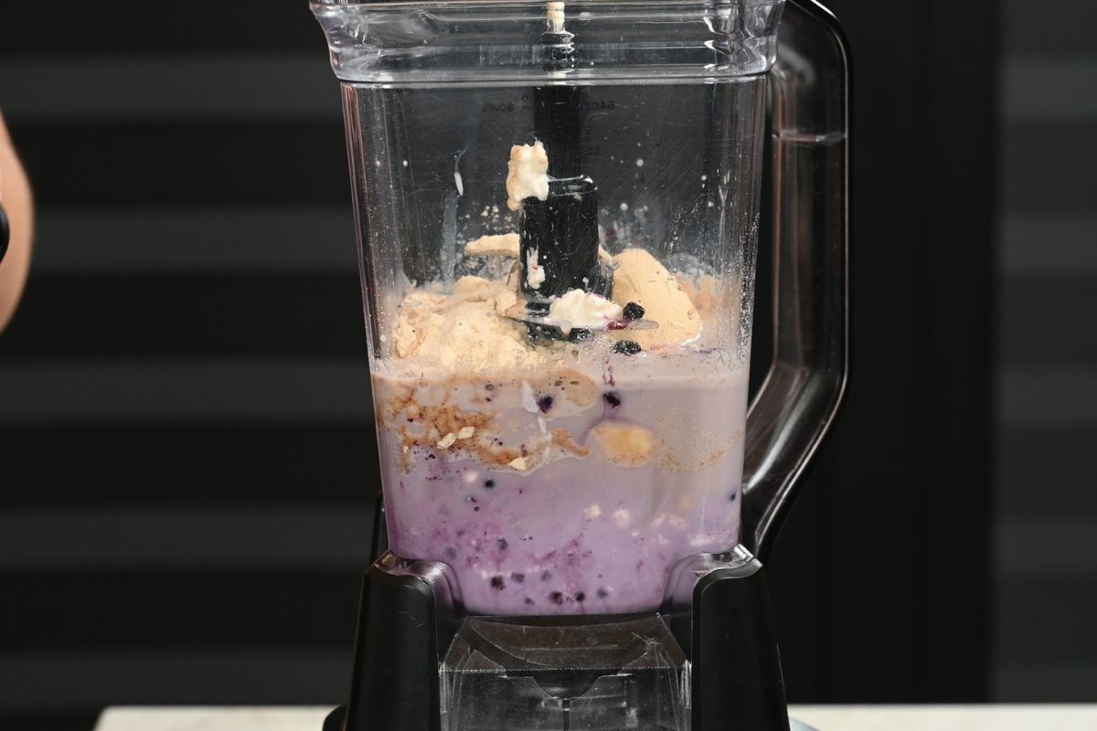 Cottage Cheese Blueberry Smoothie (High Protein!) 3 Cottage cheese blueberry smoothie ingredients in blender