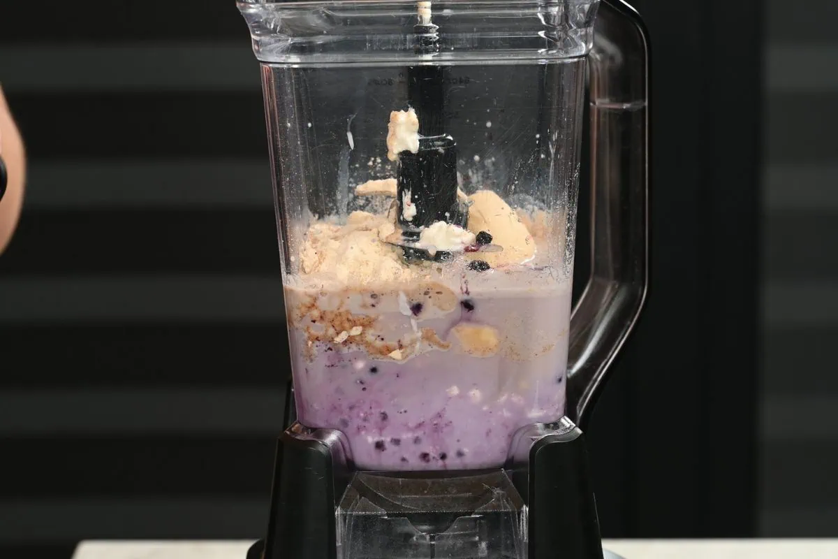 Cottage Cheese Blueberry Smoothie (High Protein!) 3 Cottage cheese blueberry smoothie ingredients in blender