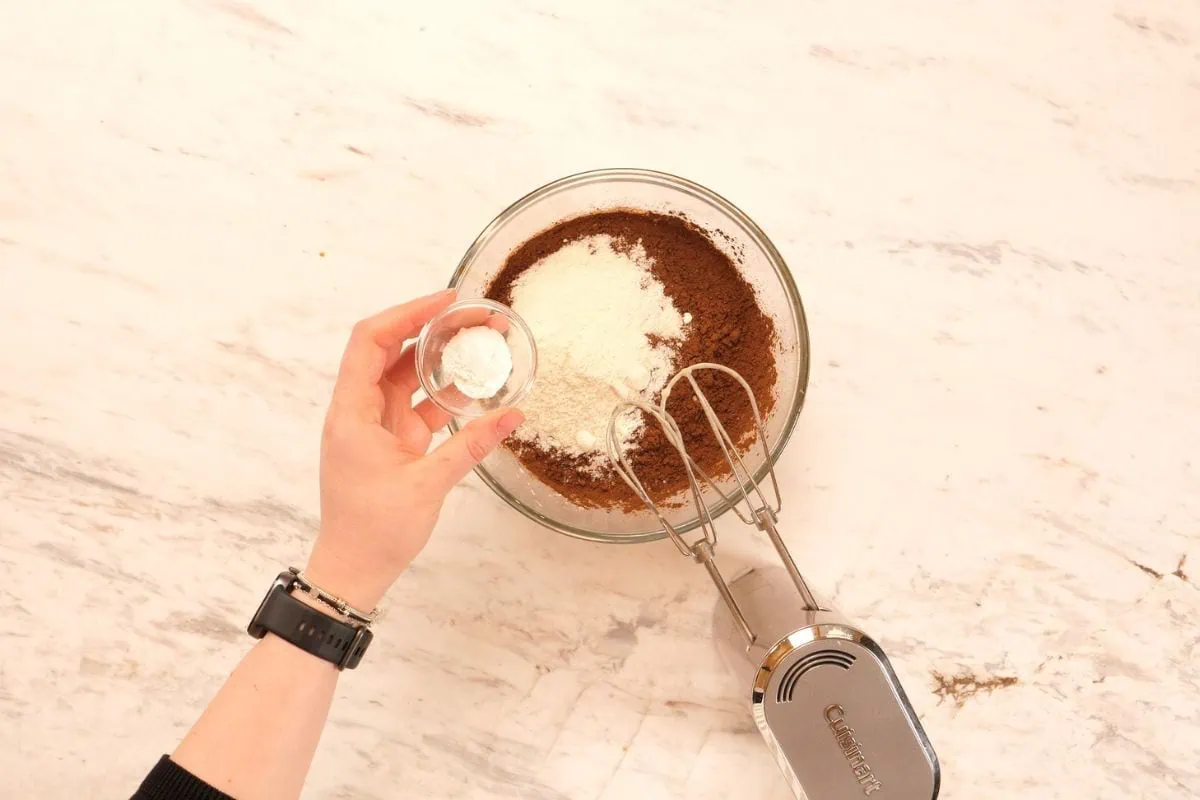 Greek Yogurt Chocolate Protein Muffins 7 Mixing wet ingredients for Greek yogurt chocolate protein muffins.