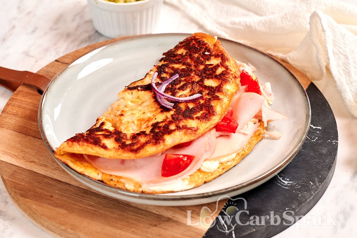 Crispy halloumi egg wrap with golden cheese crust and savory filling on a serving plate
