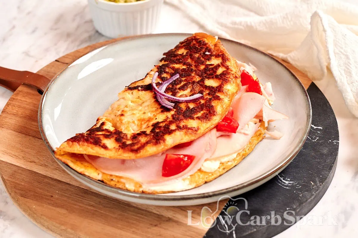 Crispy Halloumi Egg Wrap (High Protein, Low Carb) 9 Crispy halloumi egg wrap with golden cheese crust and savory filling on a serving plate